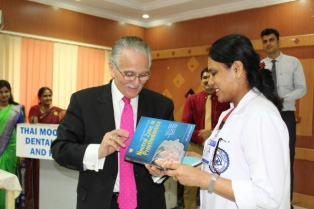 Dr. Joe Massad presenting his compilation to Dr. Rathika Rai