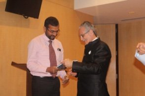 A fortunate reader being presented the signed copy of book